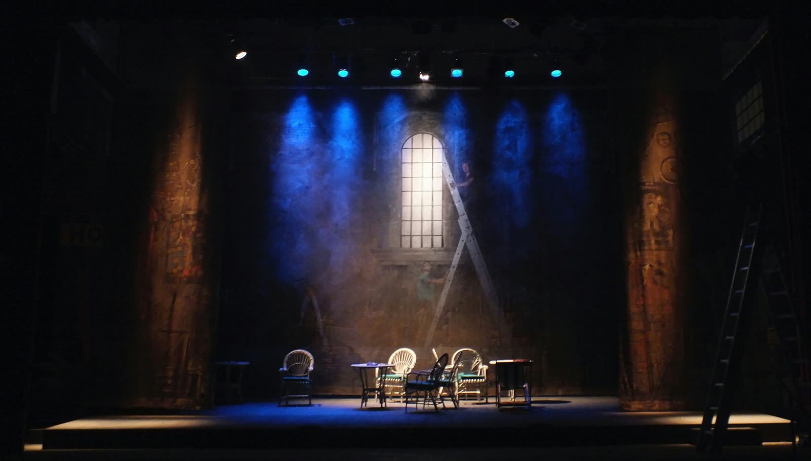 A softly lit theatre stage set